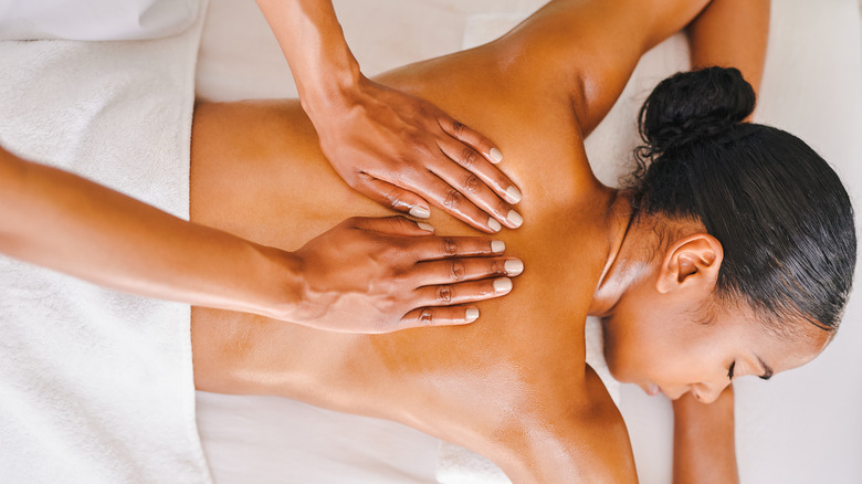 Woman receiving a back massage