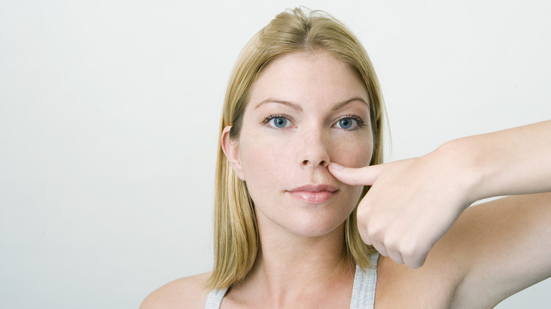 Woman practicing accupressure