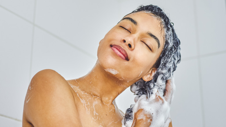 woman washing hair in shower