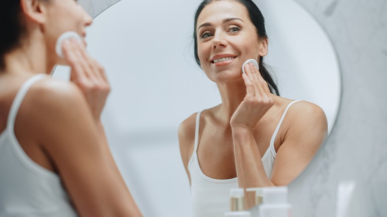 Woman applies saltwater solution 