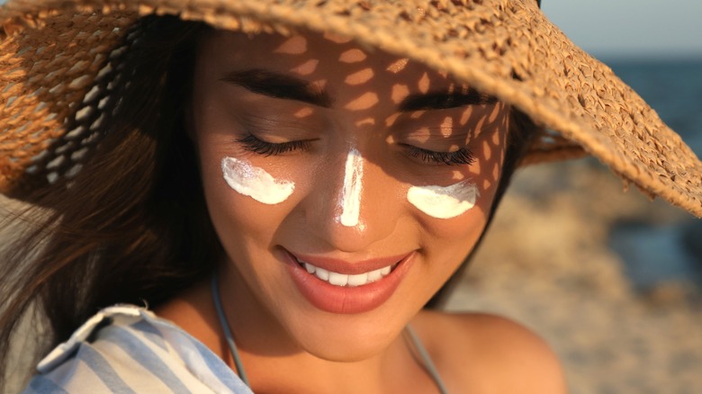 Woman with sunscreen on face