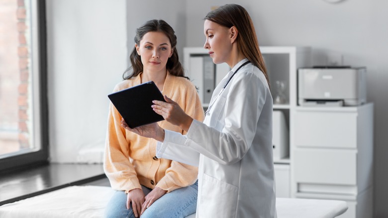 woman talking to doctor