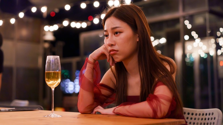 Sad woman at restaurant