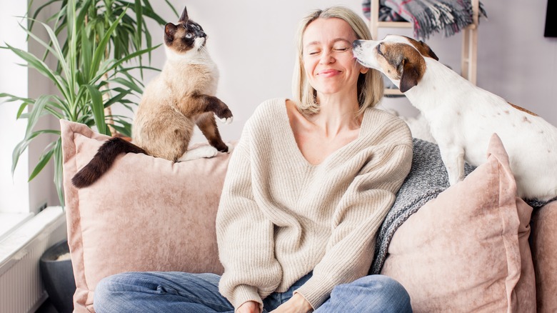 Woman on couch with pets
