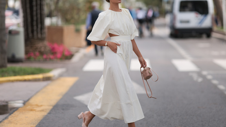 Woman wearing a loose and flowy summer dress.