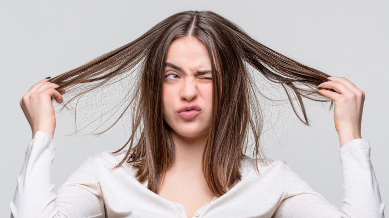 woman annoyed at hair 