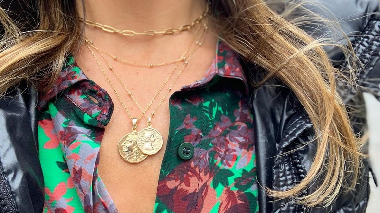 Two gold medallion necklaces