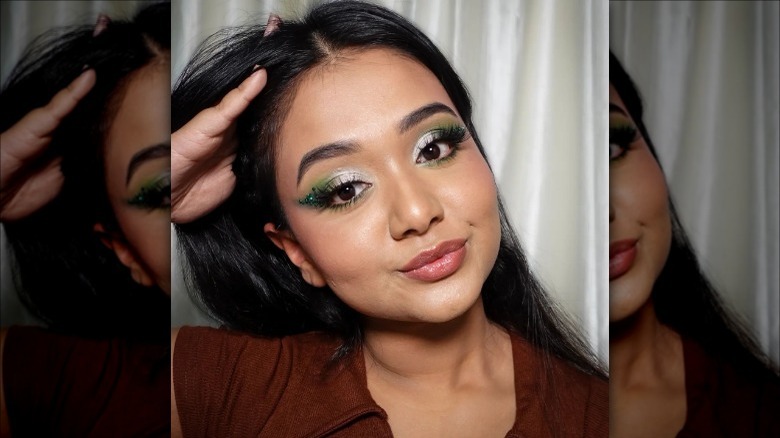 woman with green and white eyeshadow
