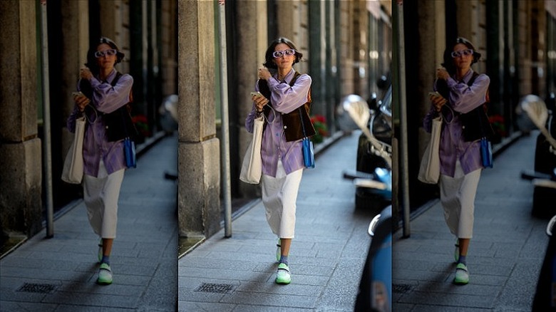 woman with phone bag and tote