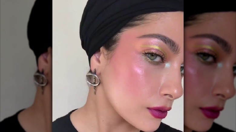 woman facing right rose gold pink highlighter