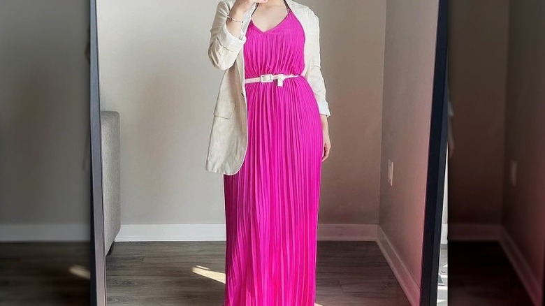 Woman in pink pleated dress 