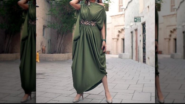 Woman in green draped dress 