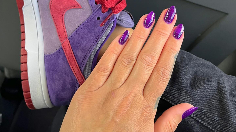 Purple nails Nike suede sneakers