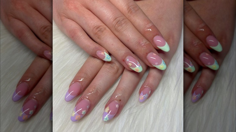 Pastel French manicure with flower designs 