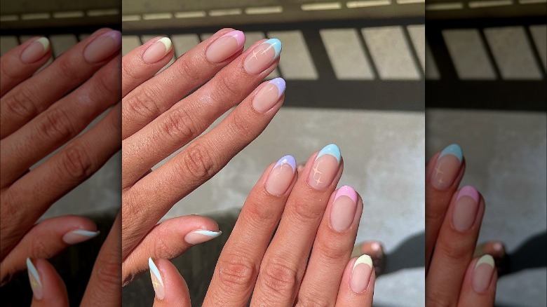 Bright pastel French tips with small sparkle detail