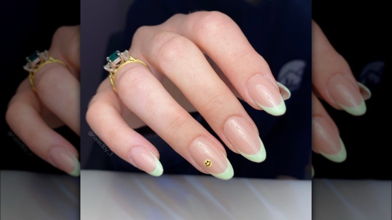 Green pastel French tips with smiley face design