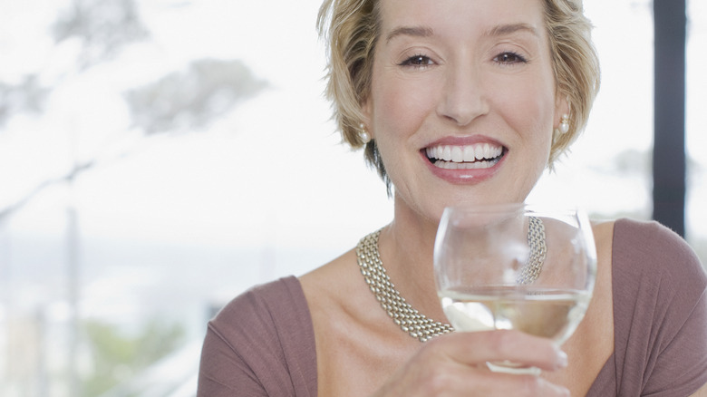 female drinking wine