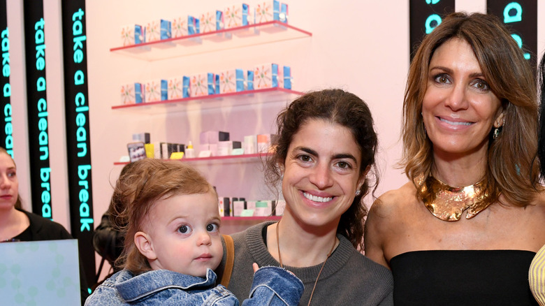 A child, Leandra Medine, and Tiffany Masterson