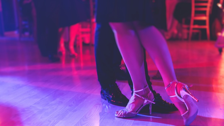 view of shoes from couple dancing