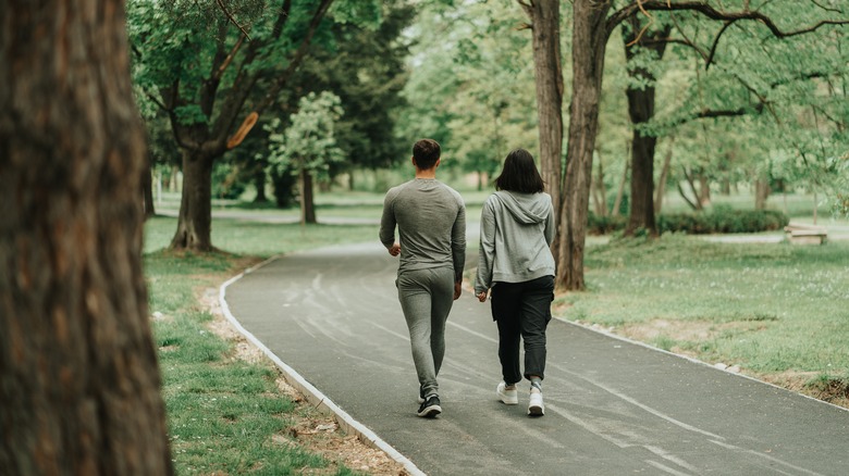 couple walking through nature