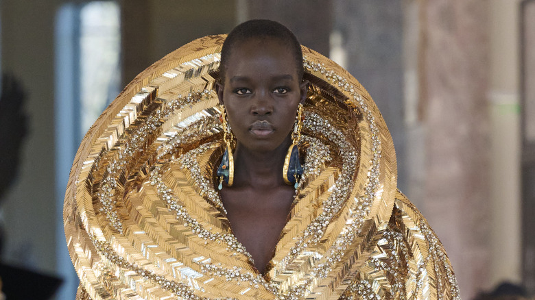 Model with large gold earrings