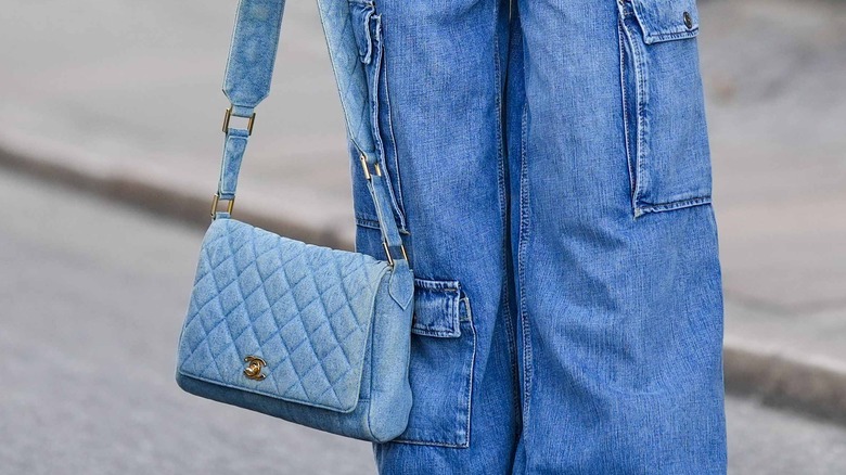 woman with dusty blue purse