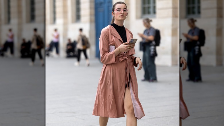 Woman wearing blush trenchcoat