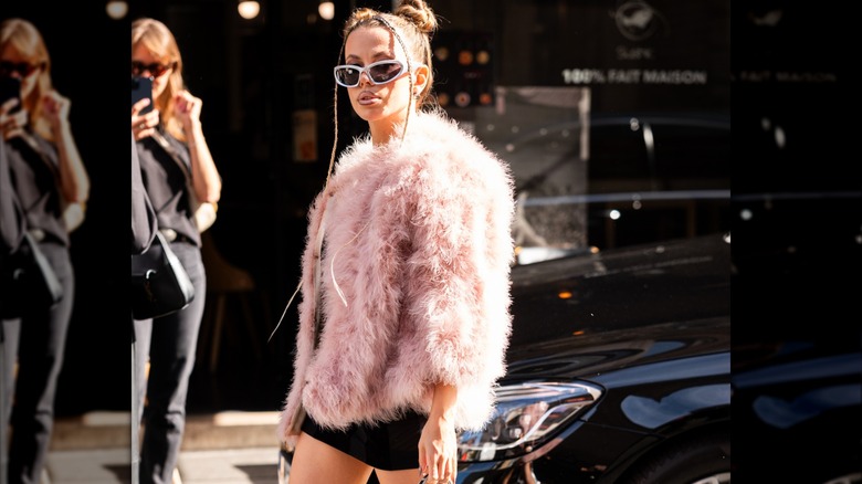 Woman wearing blush fur coat