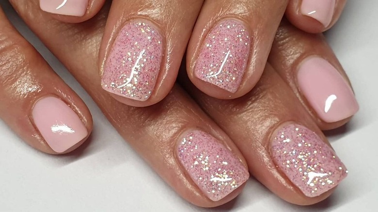 Glittery pale pink nails