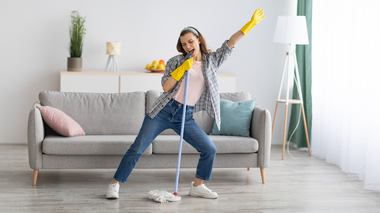 woman cleaning and singing