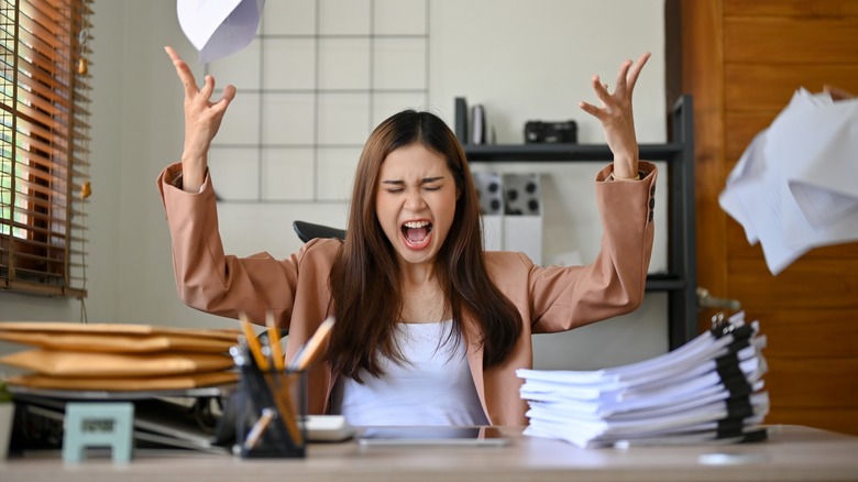 stressed woman at desk