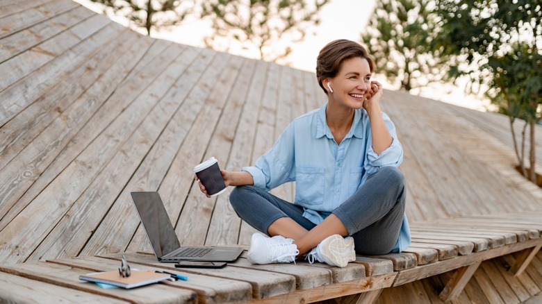 smiling woman with airpods