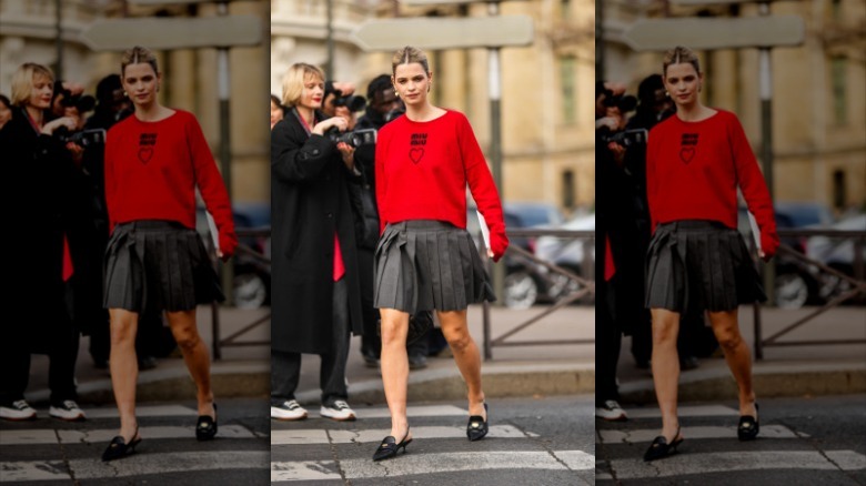 woman wearing red sweatshirt 