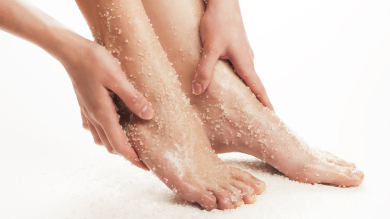 Woman using a foot scrub