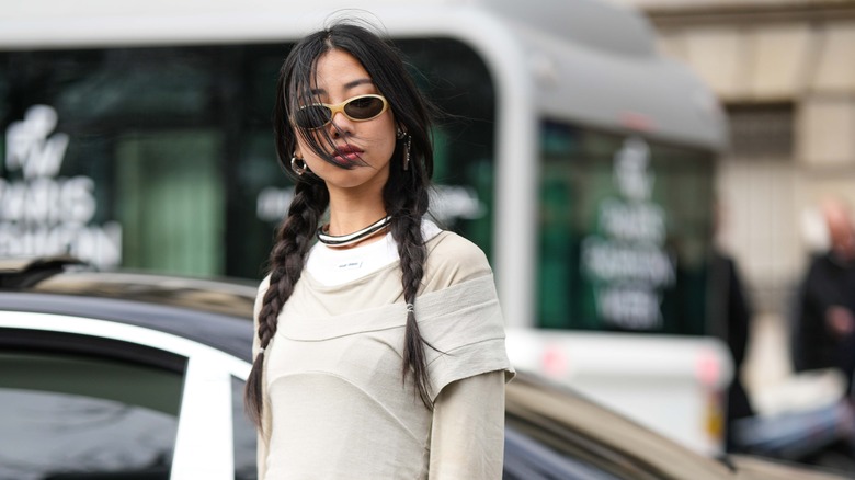 woman with braided pigtails 