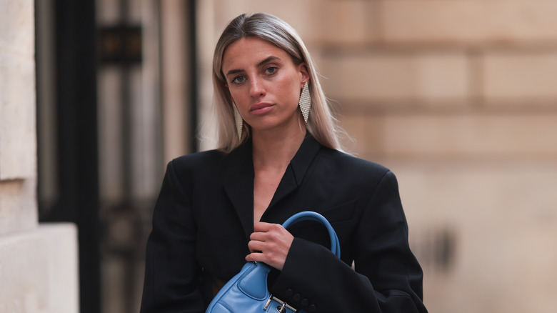 woman in statement earrings 