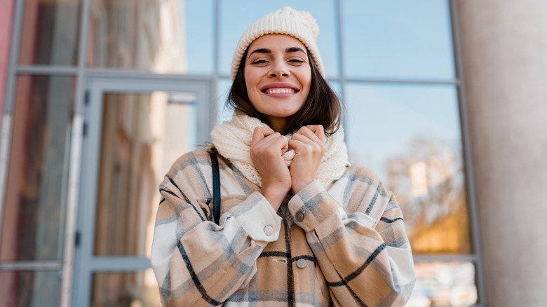 Stylish woman in plaid coat 