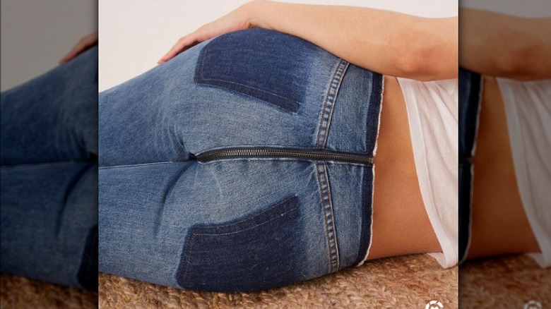 Woman wears jeans with front to back zipper