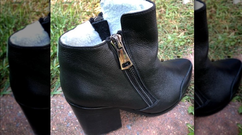 Black leather boot with oversized zippers