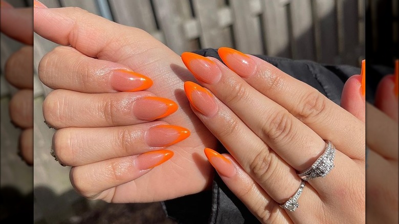 Neon orange almond nails