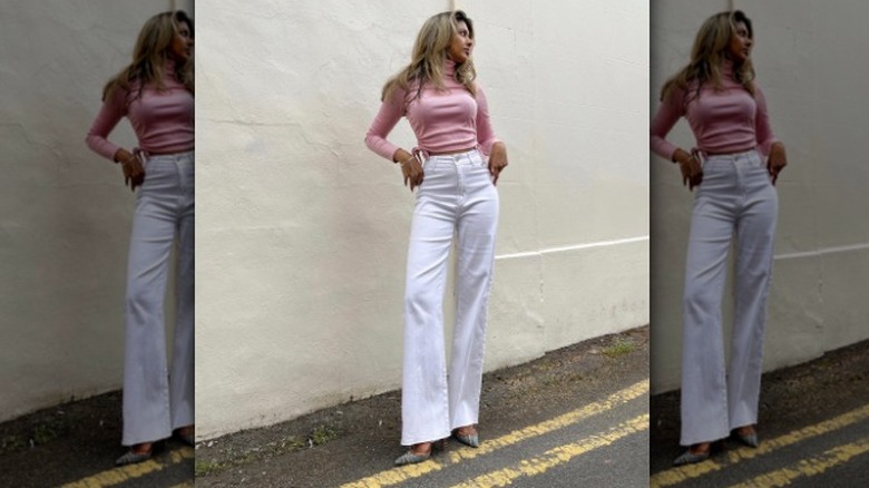 Pastel pink top and white jeans