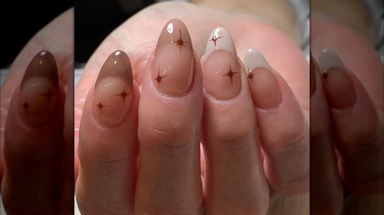 Brown and white French tip nails with star details