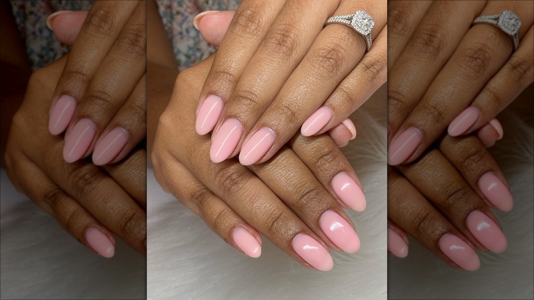 Hands with light pink medium-length nails