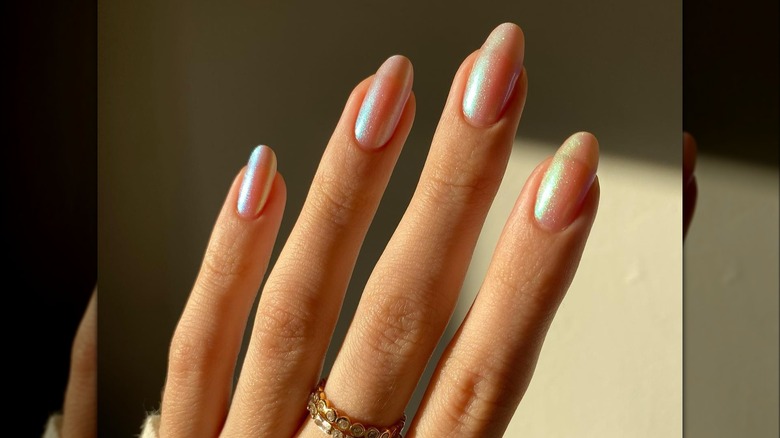 Natural long nails with sheer glitter polish