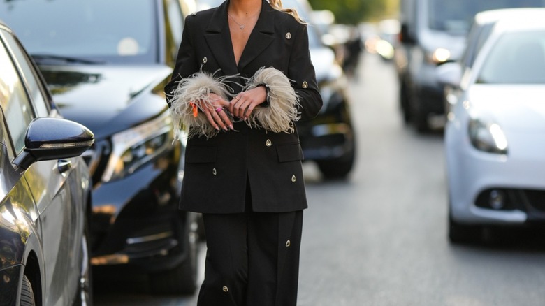 woman wearing embellished suit