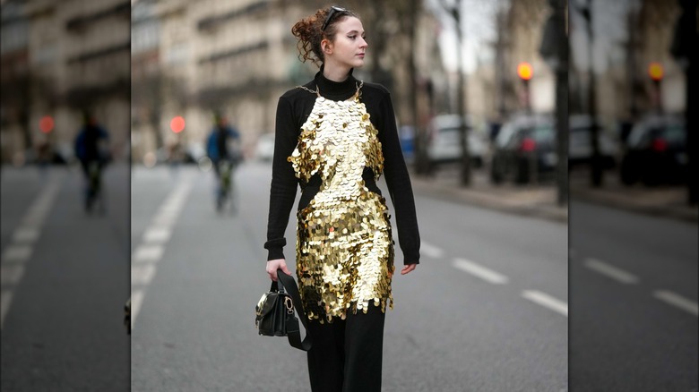 woman wearing sequined dress over top