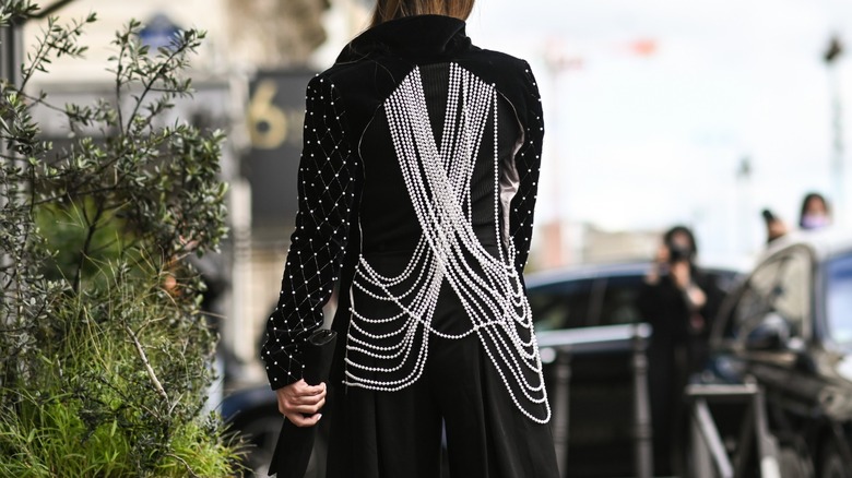 woman wearing embellished jacket