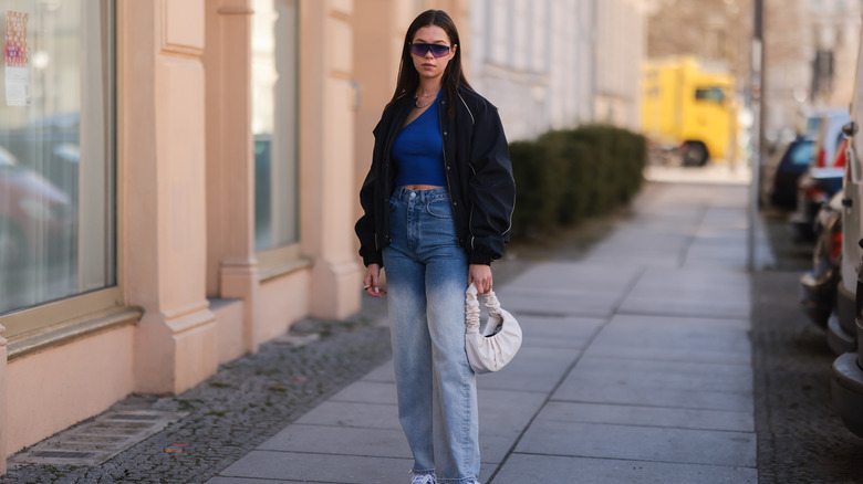 Woman wearing acid wash jeans