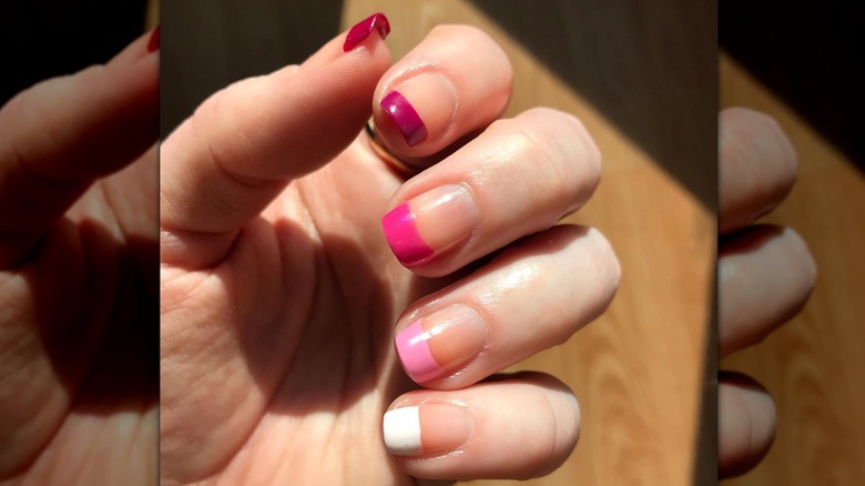 pink French tip paint chip fingernails
