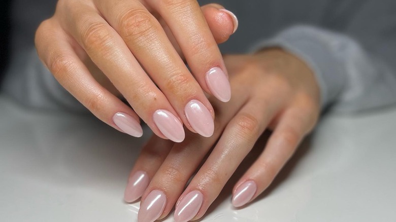 close up on pink chrome nails 